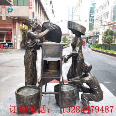 铸铜人物打谷雕塑